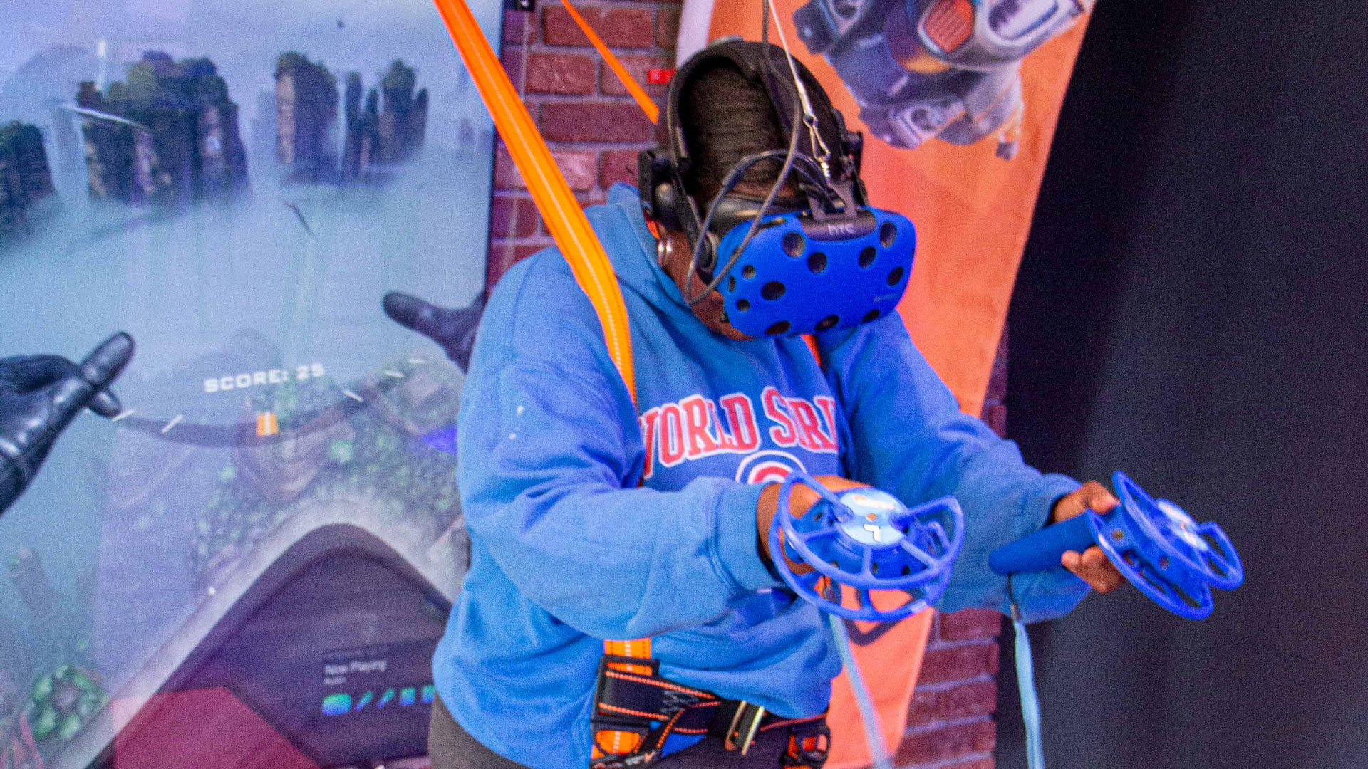 a woman experiencing VR flight with a safety harness and interactive controls