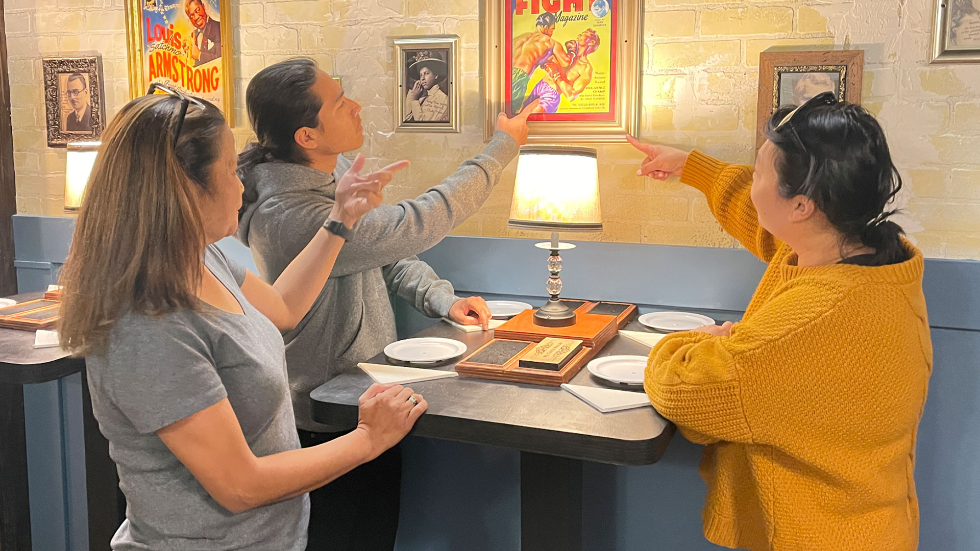 escape-room5-1920×1080 three people solving an escape room puzzle