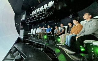 the flyer theater with a large immersive screen